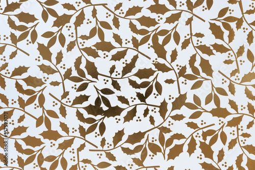 holiday themed scrapbook paper background: gold foil pattern holly leaves and berries on white