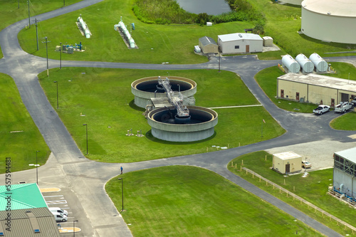 Aerial view of modern water cleaning facility at urban wastewater treatment plant. Purification process of removing undesirable chemicals, suspended solids and gases from contaminated liquid