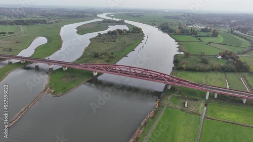 The Hanzeboog railway bridge near Zwolle over the river IJssel part of the railway line Utrecht Kampen and the railway line Lelystad Zwolle. Aerial drone overview. photo