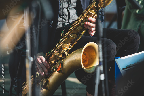Fototapeta Concert view of saxophonist, a saxophone sax player with vocalist and musical ba