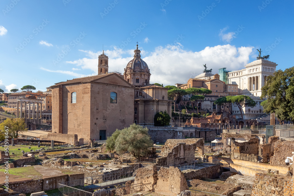 Ancient Remains in Rome, Italy. Roman Forum. Sunny Cloudy Sky.