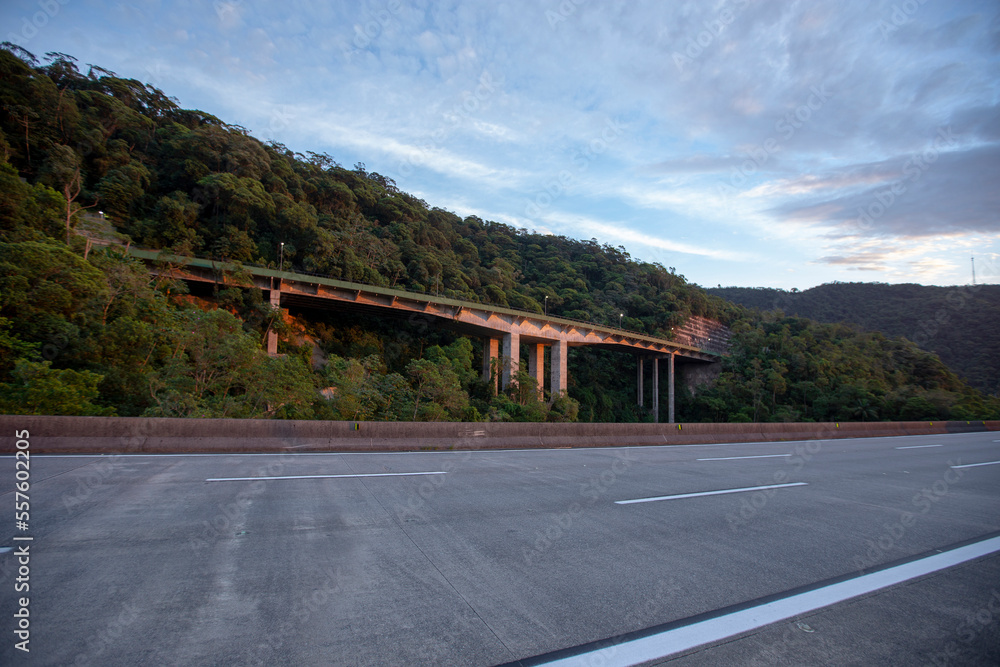 Naklejka premium View of the section of the Imigrante Highway that connects Sao Paulo to the city of Santos on the coast. Brazil. No cars