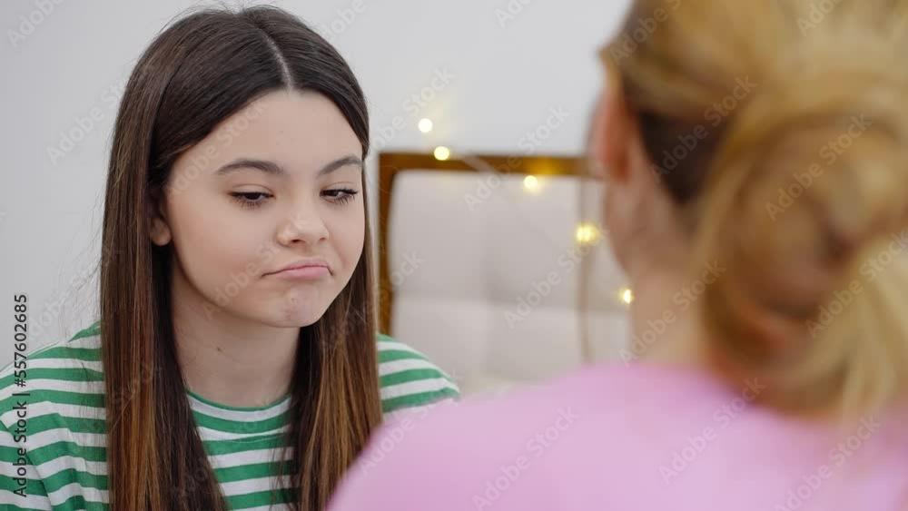 Beautiful emotional teenage girl expressing empathy and solidarity while consoling her best friend Beautiful emotional teenage girl expressing empathy and solidarity while consoling her best friend