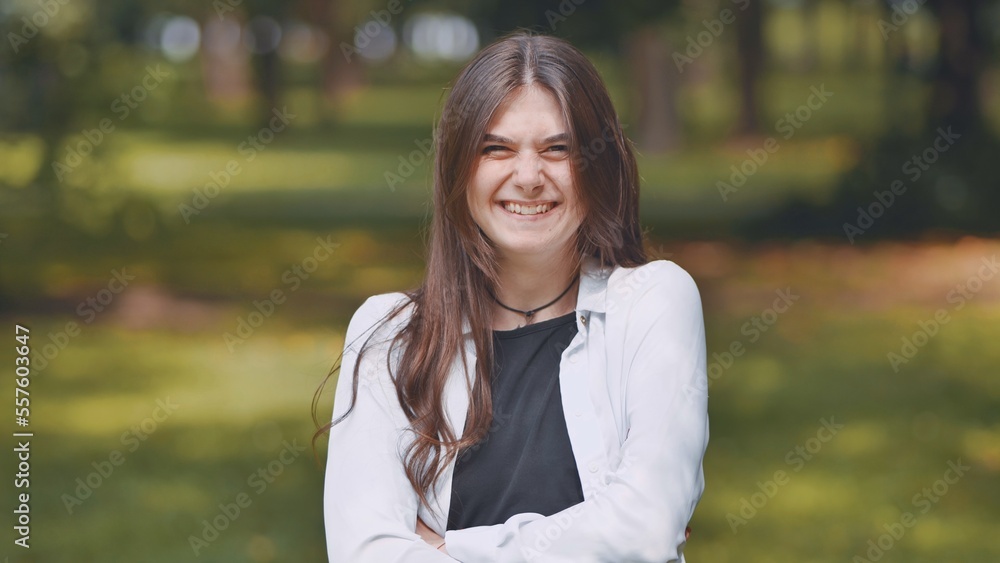 Portrait of a smiling young Georgian girl in a park. Portrait of a smiling young Georgian girl in a park.
