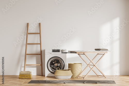 Fotografie Laundry interior with washing machine and ironing board