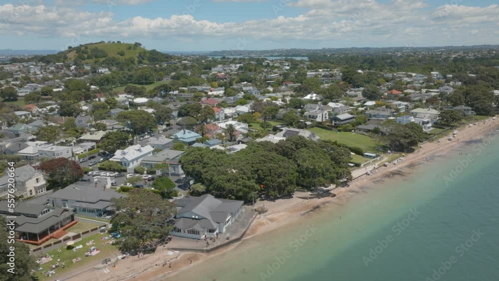 Aerial: Beach-goers at Cheltenham beach, Auckland, New Zealand Aerial: Beach-goers at Cheltenham beach, Auckland, New Zealand