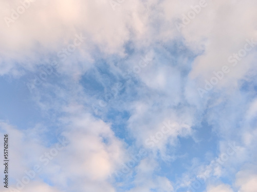 white fluffy clouds on blue sky in summer on sunny day