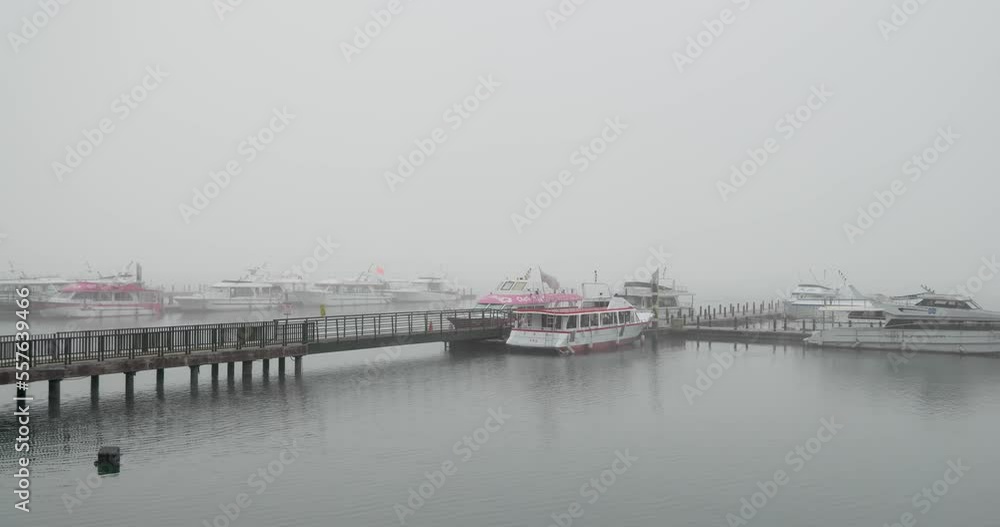 Foggy weather in Sun moon lake jetty pier at Nantou of Taiwan Foggy weather in Sun moon lake jetty pier at Nantou of Taiwan