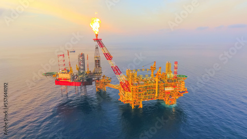Areal photography from top view of jack up rig scenery with blue ocean view.