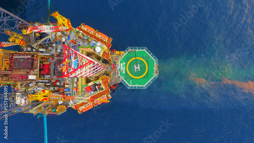 Areal photography from top view of jack up rig scenery with blue ocean view.