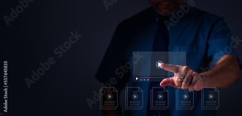 Businessman making video content of business 4.0 in 2023. Man using hand and keyboard for streaming online on virtual screen, watching video on internet, live concert, show or tutorial, content online