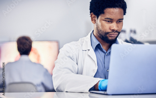 Science, black man or laptop for typing, online research or laboratory for healthcare. Researcher, scientist or African American male with digital planning, update sample data or focus for innovation