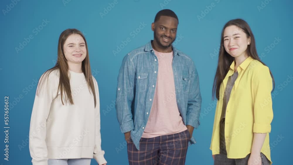 Happy and smiling multiethnic group of friends dancing, having fun and looking at camera. Fashion and style of dress. Happy and smiling multiethnic group of friends dancing, having fun and looking at camera. Fashion and style of dress.