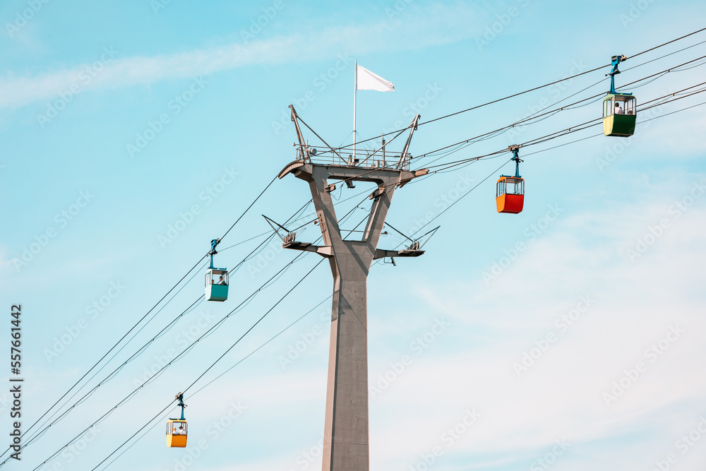 Cable car gondolas transporting tourists from station in Rheinpark in Cologne, Germany. Sightseeing and attractions concept - obrazy, fototapety, plakaty 