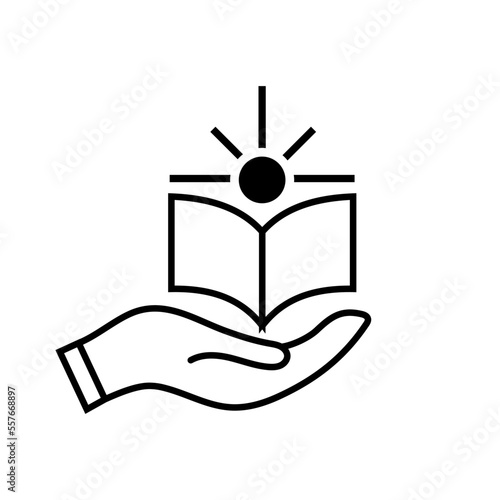 hand holding book with sun shine.
