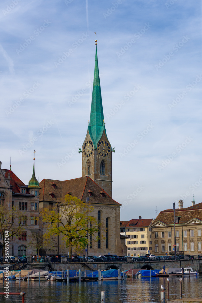 Famous church Women's Minster at the medieval old town of Zürich on a blue cloudy autumn day. Photo taken October 30th, 2022, Zurich, Switzerland.