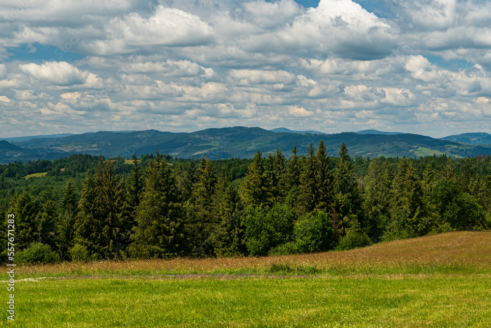 Nearer hills of Jablunkovske medzihorie and Moravskoslezske Beskydy mountains from meadow bellow Lieskova hill summit in Kysucke Berskydy mountains in Slovakia