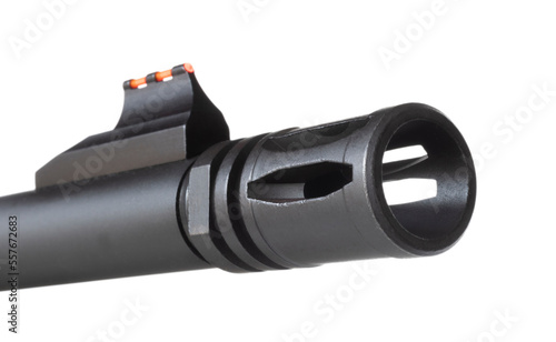 Rifle muzzle with a flash hider and red sight photo