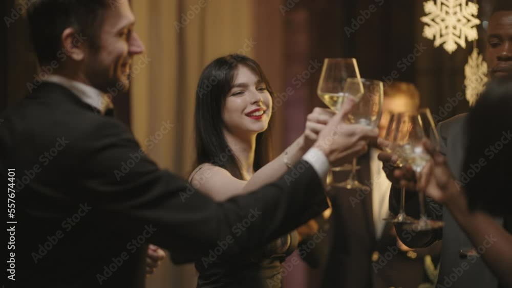 happy people celebrating New year, clinking champagne and congratulating, multiethnic friends group happy people celebrating New year, clinking champagne and congratulating, multiethnic friends group
