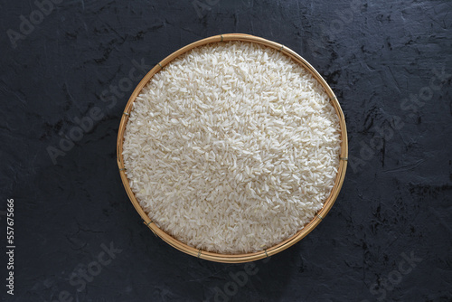 Paddy and rice in baskets placed on a black background. 