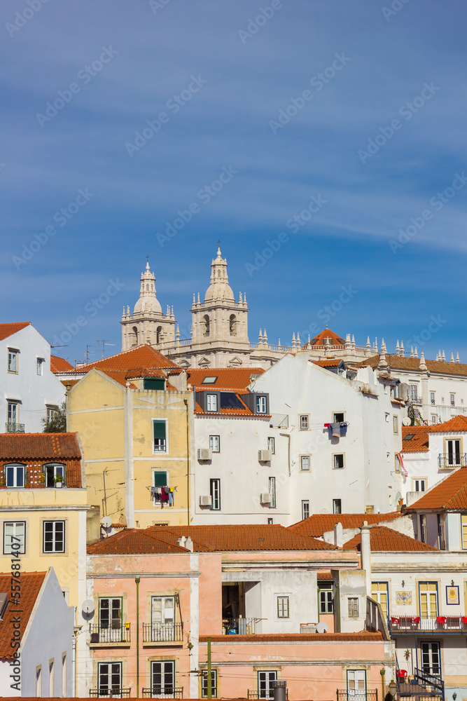 Towers of the Sao Vicente church and traditional houses in Lisbon, Portugal