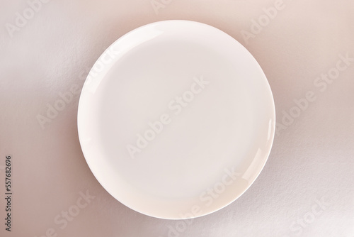 White plate on a gray background. Graphic background for designers.