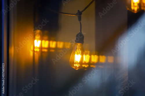 lamp in the window of a cafe showcase. details of the decorative interior of the building photo