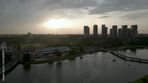 Bekasi, Indonesia - December 24, 2022: Apartment area in Cikarang, Bekasi with lake around with sunset view photo