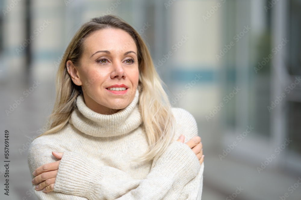 Attractive middle aged woman with her arms crossed Attractive middle aged woman with her arms crossed