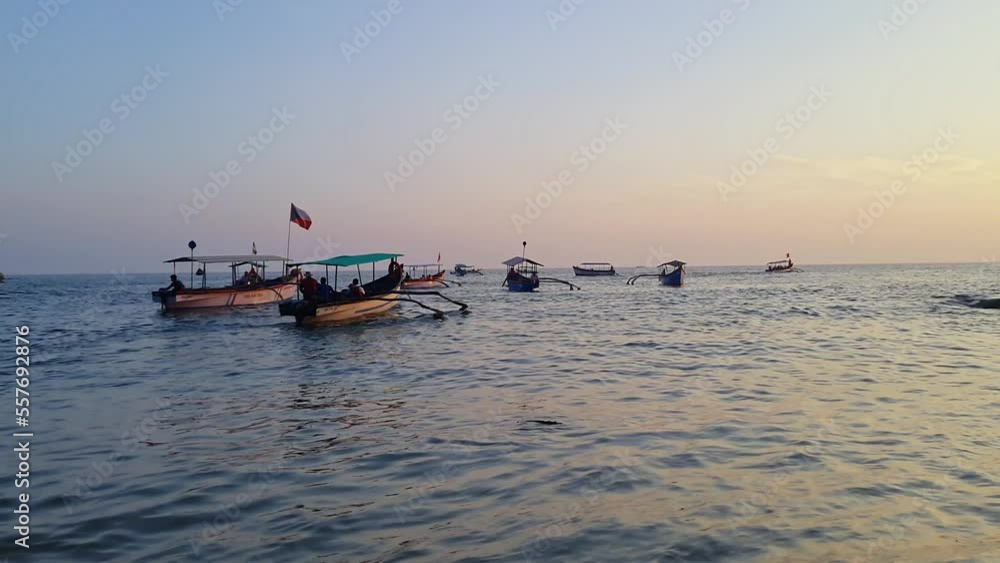 Beautiful beach and sightseeing boats with tourists floating on sea Beautiful beach and sightseeing boats with tourists floating on sea