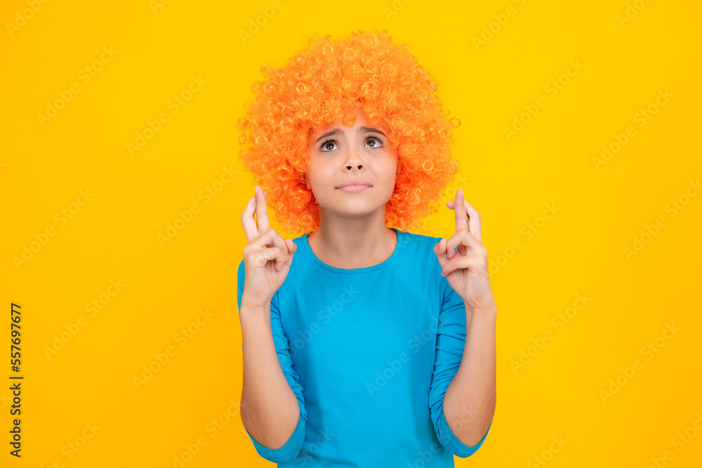 Girl with yellow wig. Funny child wearing orange curly wig hair, summer fun. Girl with yellow wig. Funny child wearing orange curly wig hair, summer fun.