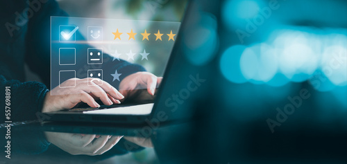 Five stars (5) rating with a businessman touching screen. User give rating to service experience on online application for Customer review satisfaction feedback survey concept.