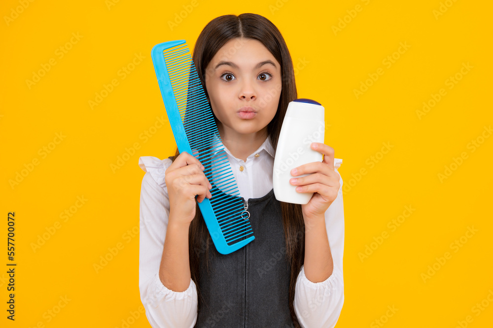 Funny face. Teenager child girl with bottle shampoo conditioners or shower gel. Kids hair care. Hair cosmetic product, shampoo bottle. Funny face. Teenager child girl with bottle shampoo conditioners or shower gel. Kids hair care. Hair cosmetic product, shampoo bottle.