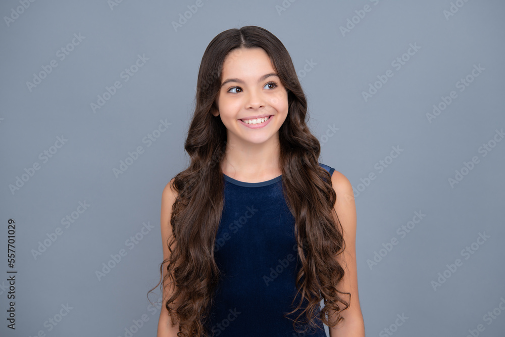 Children studio portrait on gray background. Childhood lifestyle concept. Cute teenage girl face close up. Happy girl face, positive and smiling emotions. Children studio portrait on gray background. Childhood lifestyle concept. Cute teenage girl face close up. Happy girl face, positive and smiling emotions.
