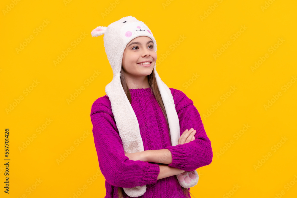 express positive emotion. glad child in earflap hat. kid wear warm clothes