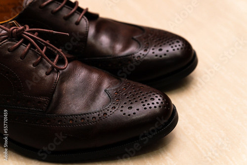 Brown brushed leather shoe with broguing © MU Studio