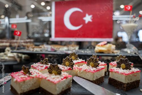 Close-up of fresh and delicious pastries served on table with Turkish national flag in the background at restaurant in buffet