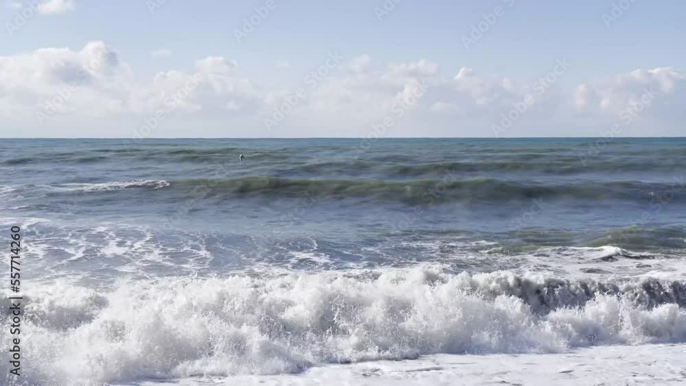 The powerful surf of the waves and the foam of the sea break on the shore The powerful surf of the waves and the foam of the sea break on the shore