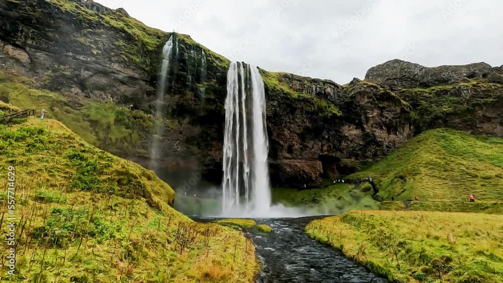 Seljalandsfoss is waterfall in the South Region in Iceland of which visitors can walk behind the fall into a small cave. Seljalandsfoss is waterfall in the South Region in Iceland of which visitors can walk behind the fall into a small cave.