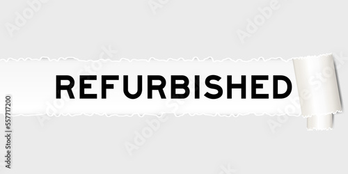 Ripped gray paper background that have word refurbished under torn part