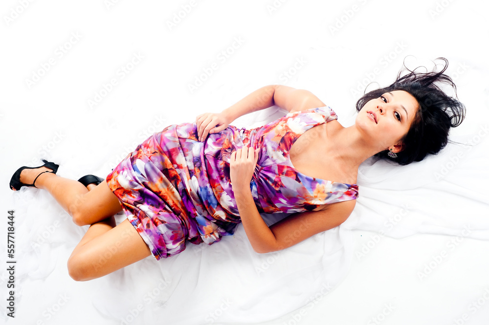 Naklejka premium Young pretty woman lying on floor