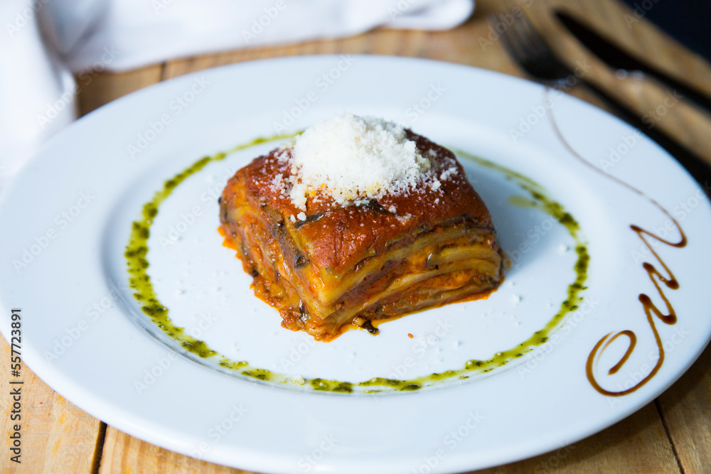 Lasagna is a type of pasta. It is usually served in overlapping sheets interspersed with layers of ingredients to taste, most often meat in bolognese sauce and béchamel.
