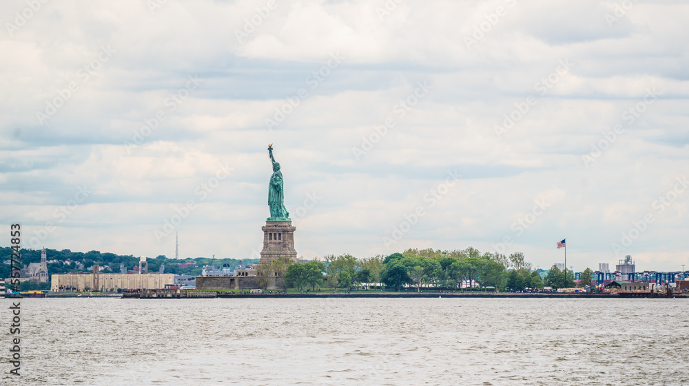 Liberty island with the Statue of Liberty from the water lever in NYC, USA Liberty island with the Statue of Liberty from the water lever in NYC, USA