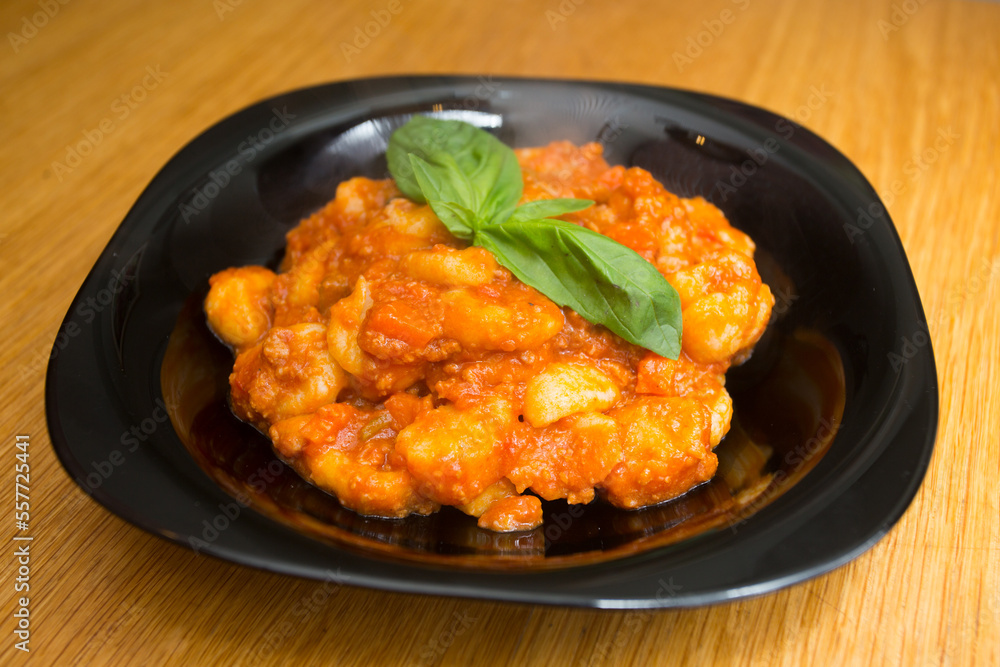 Gnocchi with bolognese sauce and tomato. Traditional Italian recipe. Gnocchi with bolognese sauce and tomato. Traditional Italian recipe.