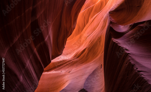 Antelope canyon narrow walls with shadows and red sand in Arizona, USA