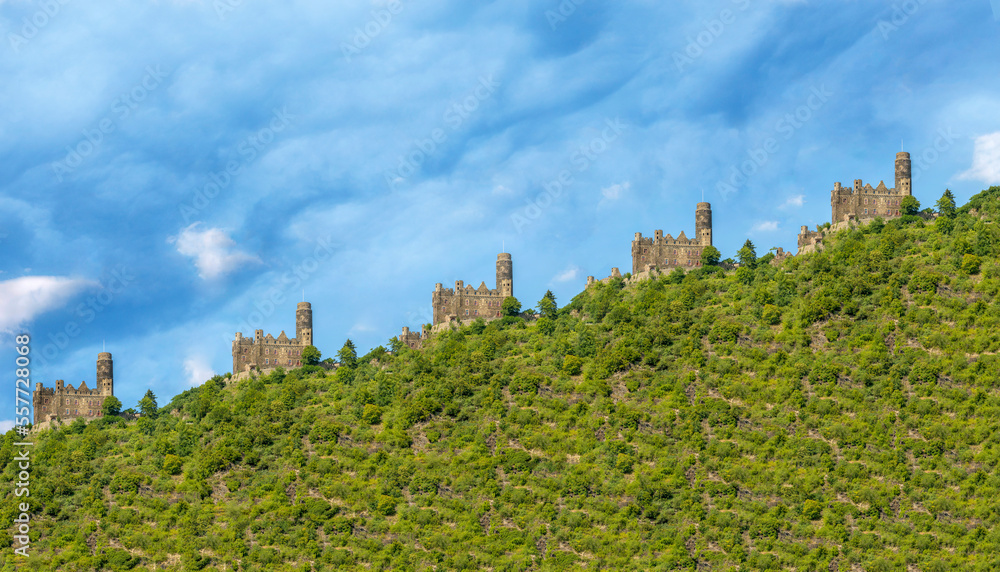Collage with an old castle on the mountainside