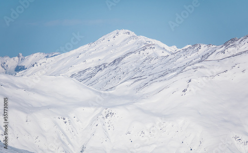 White photo of alpine mountains in Austria with a lot of deep snow © Kaspars