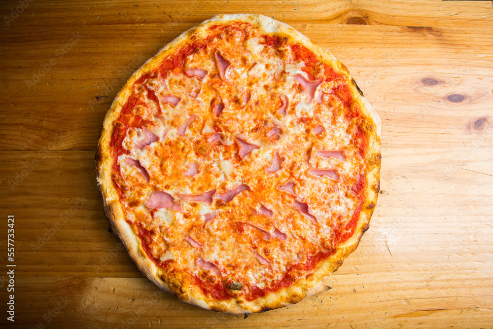 Prosciutto Pizza. Neapolitan pizza with tomato sauce, cheese and prosciutto ham. Authentic Italian recipe. Prosciutto Pizza. Neapolitan pizza with tomato sauce, cheese and prosciutto ham. Authentic Italian recipe.