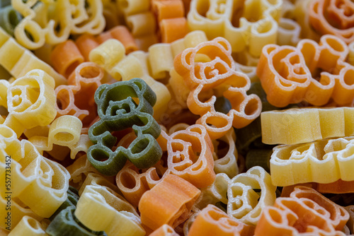 Closeup of Teddy Bear shapes colorful pasta background