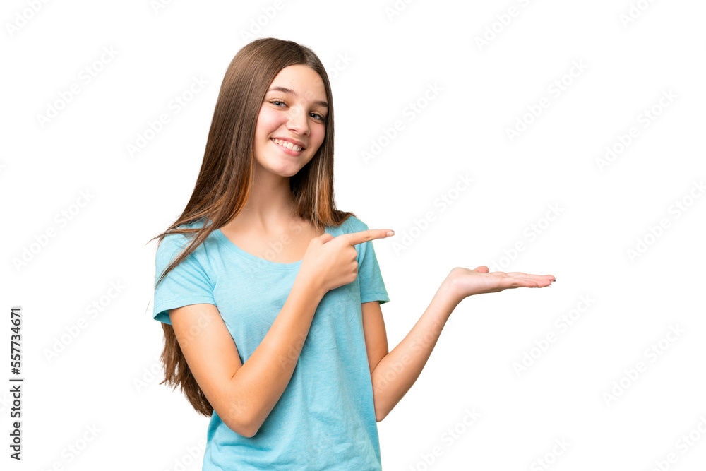 Teenager girl over isolated chroma key background holding copyspace imaginary on the palm to insert an ad Teenager girl over isolated chroma key background holding copyspace imaginary on the palm to insert an ad